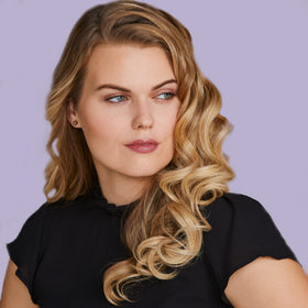 HOT TOOLS Curling Iron in use creating defined curls