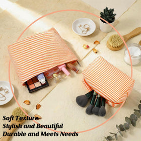 Huhumy orange striped makeup bags on a vanity