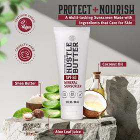 Hustle Butter Deluxe Tattoo Aftercare Sunscreen 3 oz on a beach towel