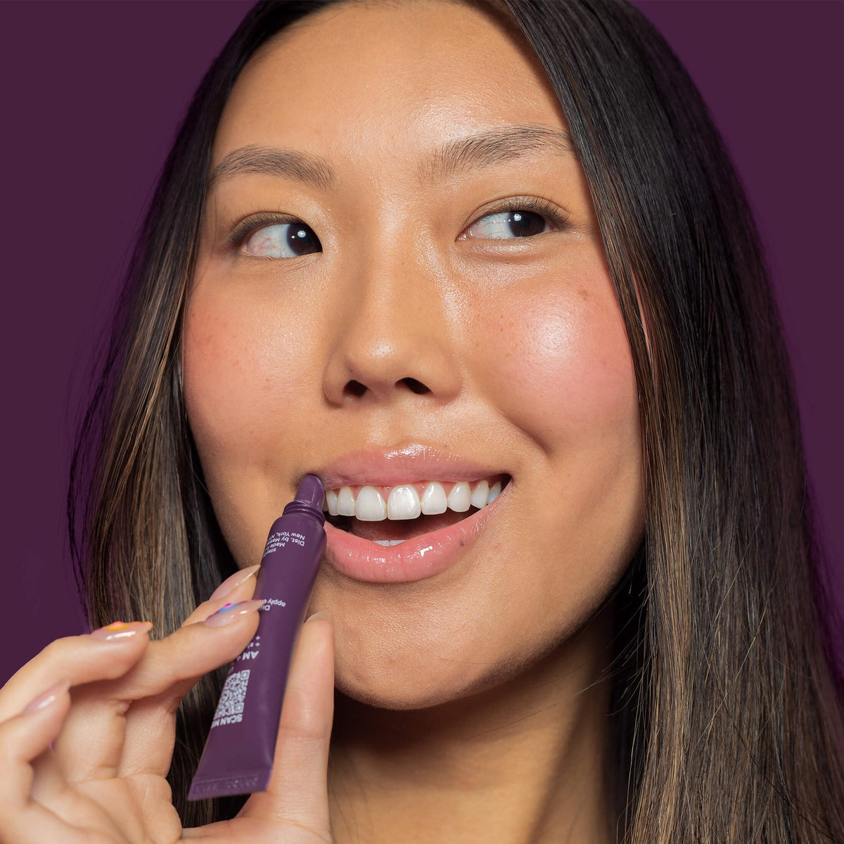 I.T.K. Nourishing Lip Balm displayed with natural ingredients