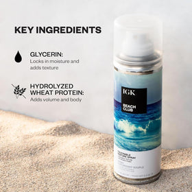 IGK Beach Club Texture Spray held in hand for application