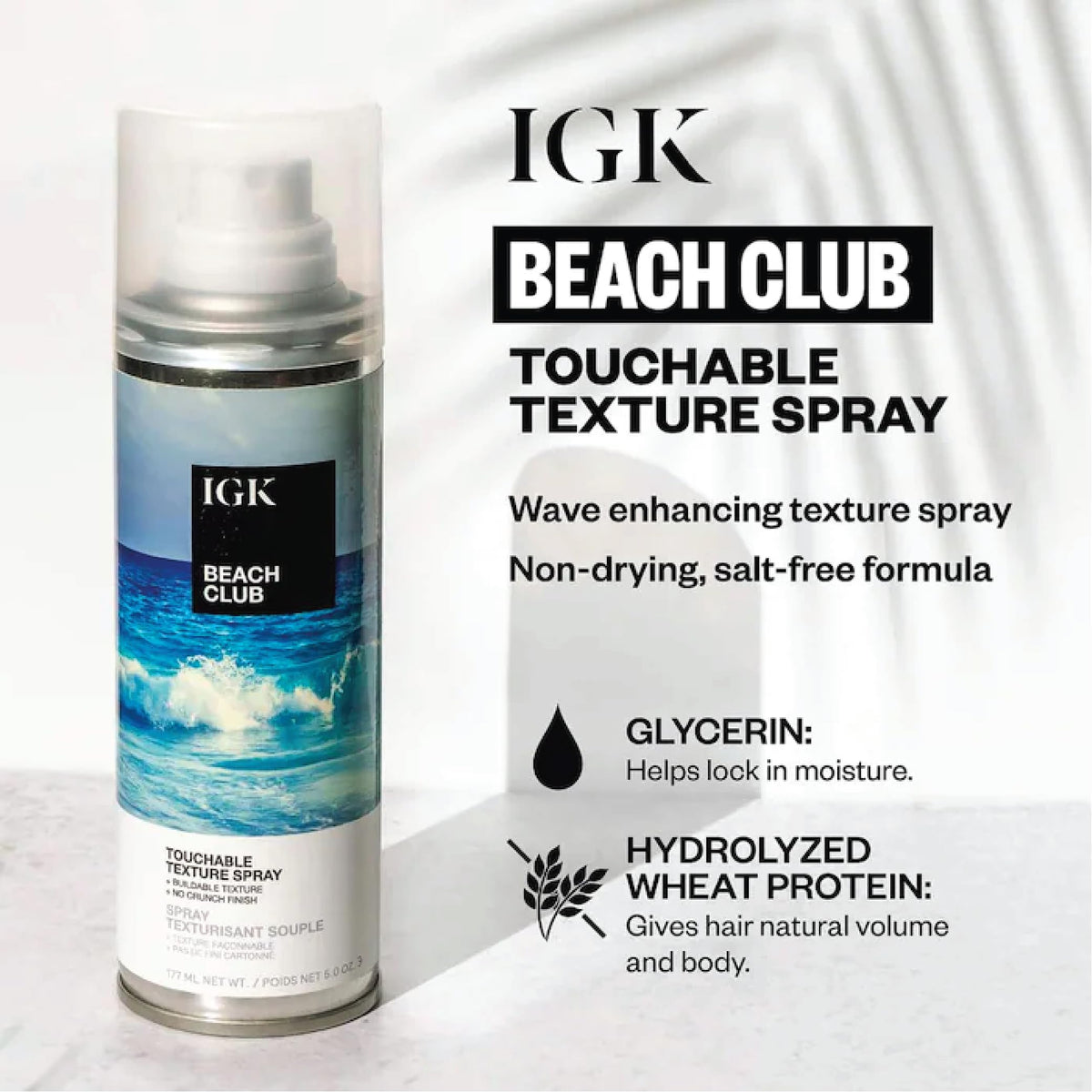 IGK Beach Club Texture Spray in a lifestyle setting on a beach