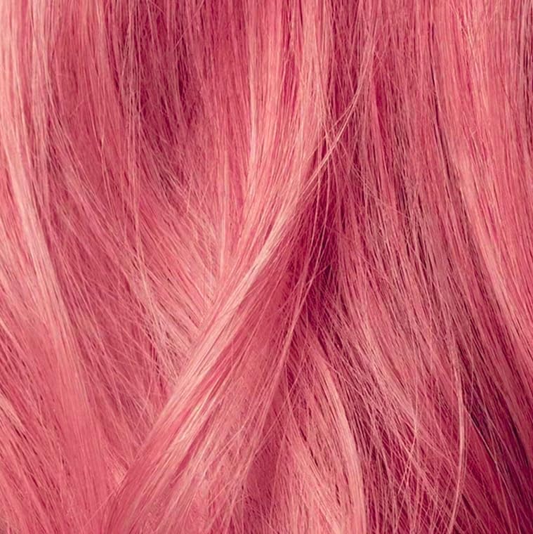 IGK Strawberry Milkshake Hair Gloss in a bathroom setting