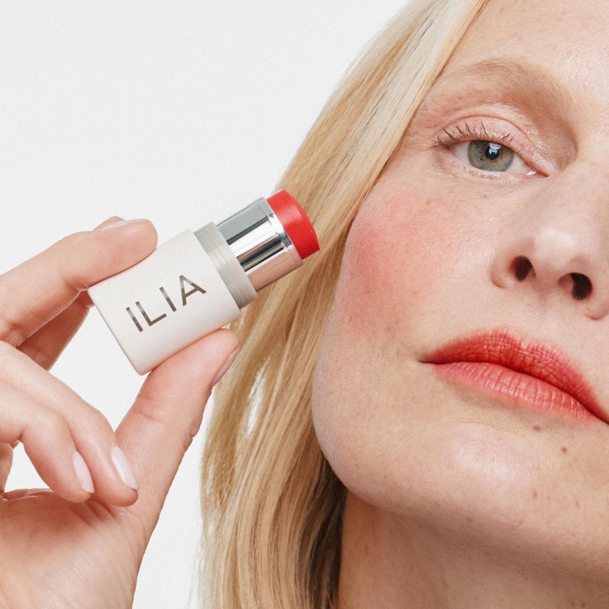 ILIA Multi-Stick Cheek + Lip Color Dear Ruby applied on cheeks