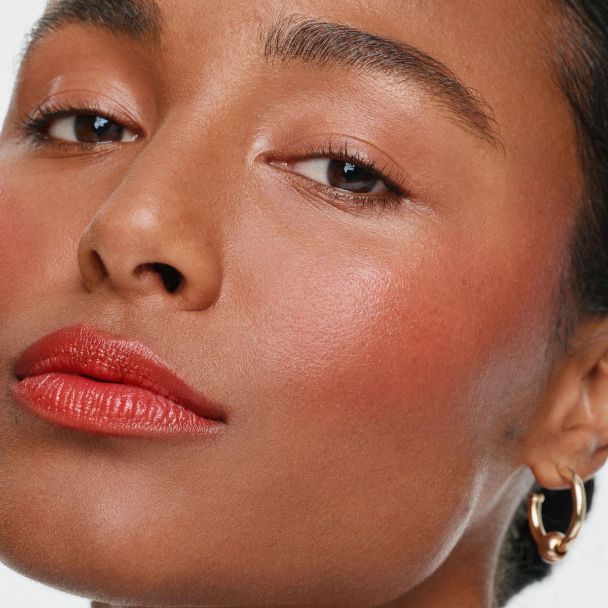ILIA Multi-Stick Cheek + Lip Color Dear Ruby applied on lips