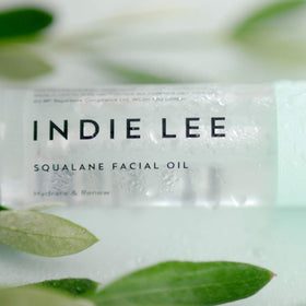 Indie Lee 100% Squalane Oil in lifestyle setting on vanity