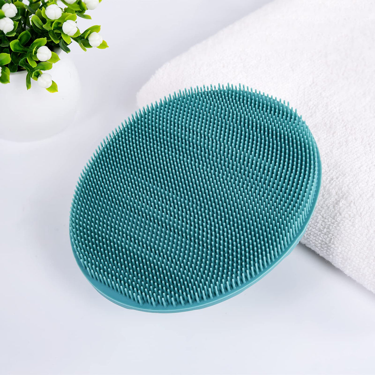 INNERNEED Silicone Body Cleansing Brush on a bathroom counter
