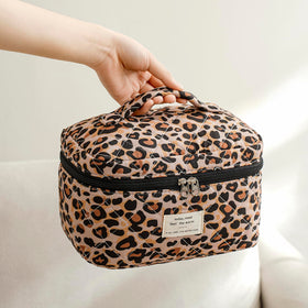 Inside view of uekeboag Large Travel Quilted Makeup Bag with makeup items