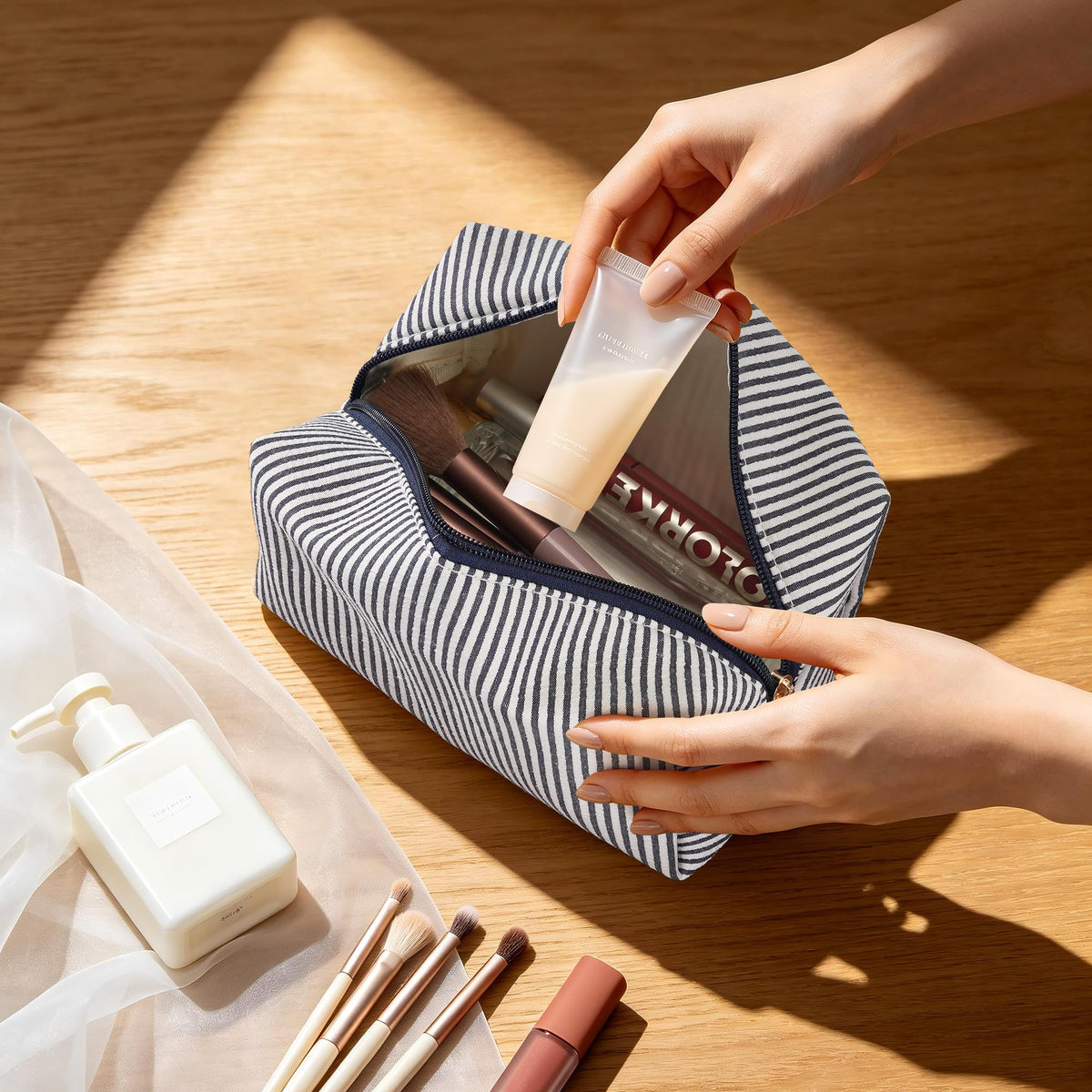 Inside view of UUYUUY cosmetic pouch with makeup items