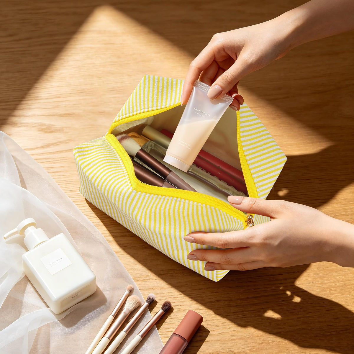 Inside view of UUYUUY cosmetic pouch with makeup items