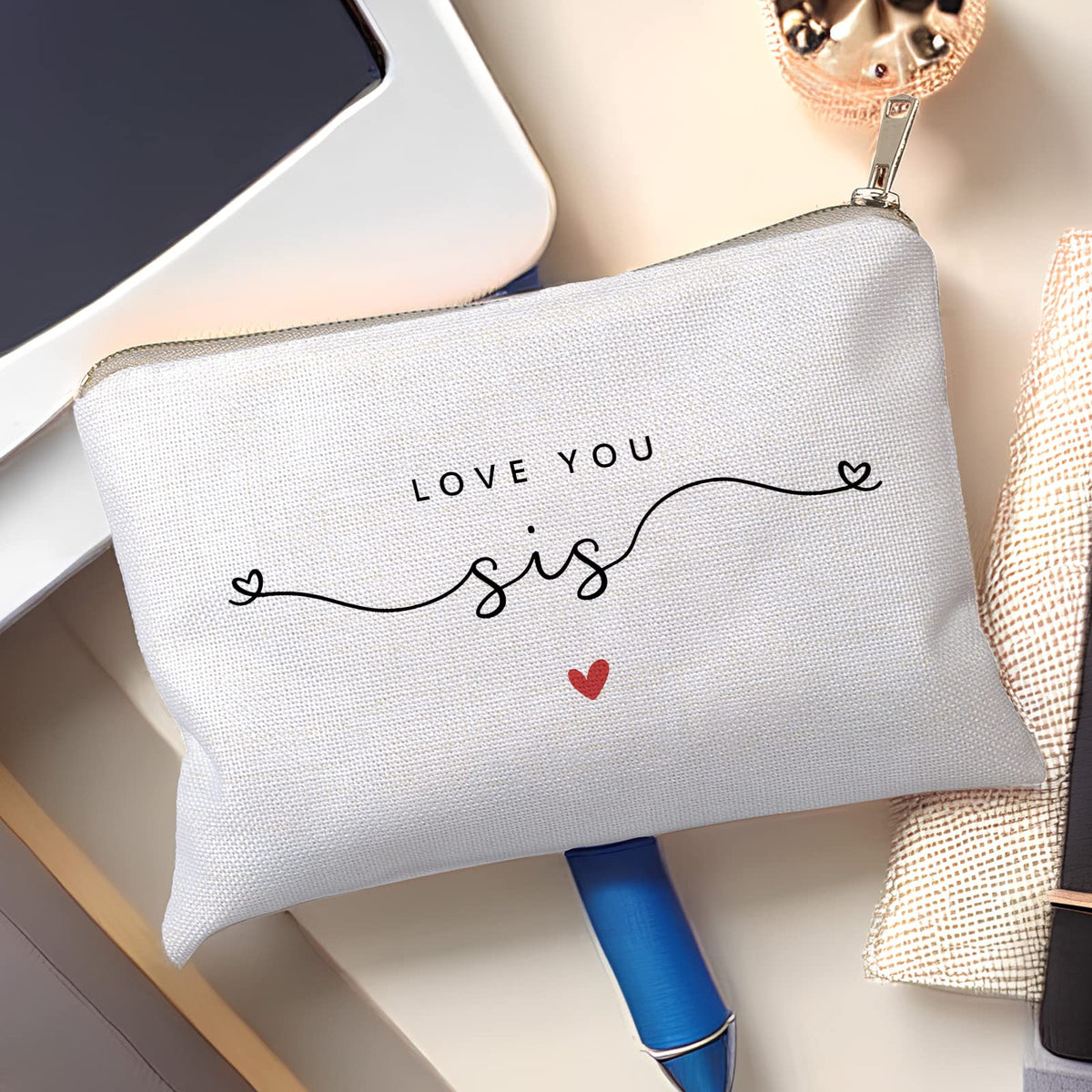 Interior of HubbgDesign Love You Sister Makeup Case filled with cosmetics