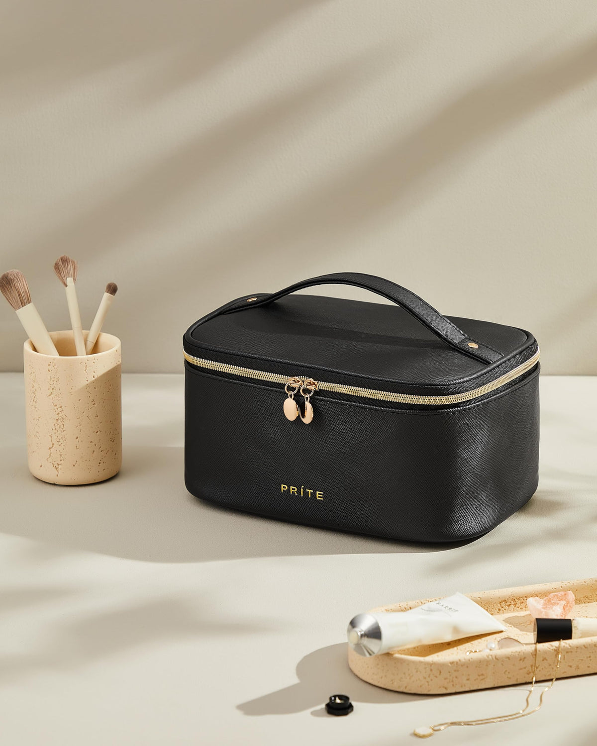 Interior view of Prite Makeup Bag showing brush slots and lipstick loops