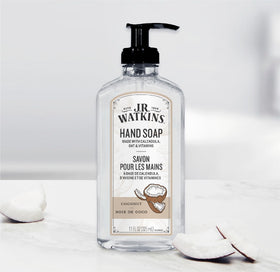 J.R. Watkins hand soap with coconut scent on a bathroom sink