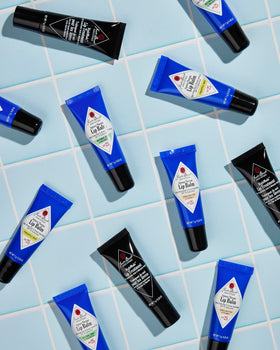Jack Black Intense Therapy Lip Balm trio displayed on a flat surface