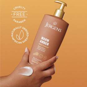 Jergens Shea Fusion Body Lotion Warm Amber on a bathroom counter
