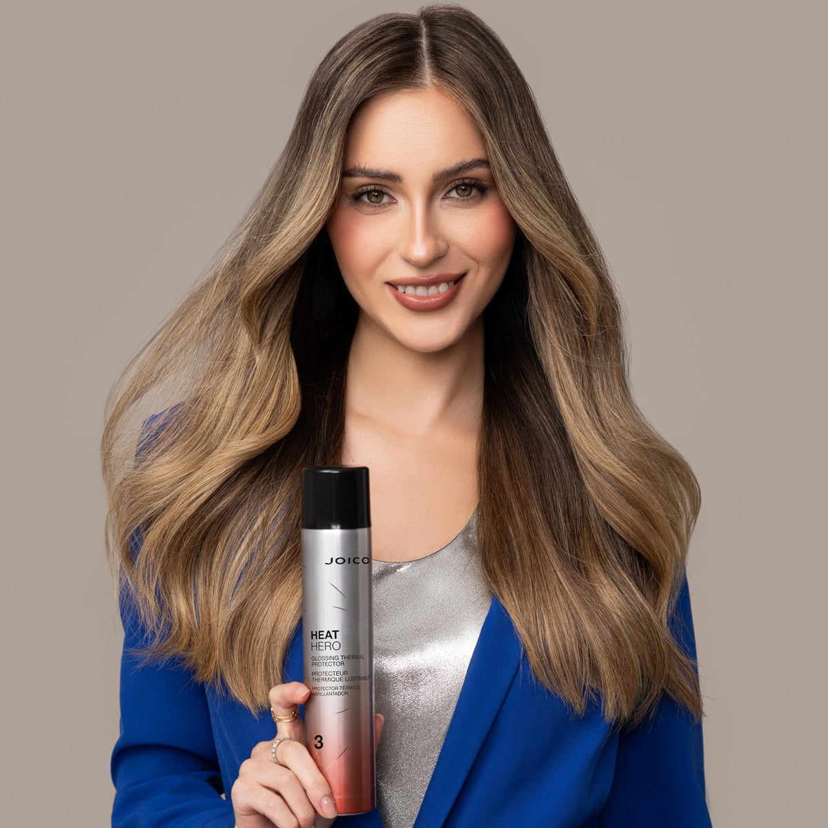Joico Heat Hero Glossing Thermal Protector being sprayed on hair