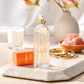 Jovan Musk for Women Eau de Cologne with floral background