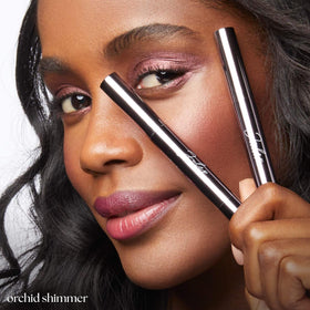 Julep Eyeshadow 101 Crème-to-Powder Stick in Orchid Shimmer on model's eyes