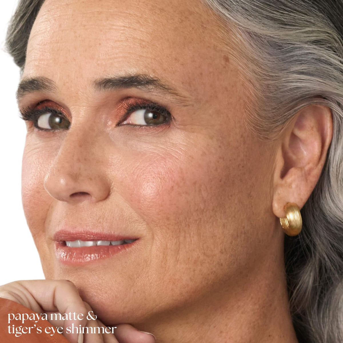 Julep Eyeshadow 101 Crème-to-Powder Stick Papaya Matte applied on eyelids