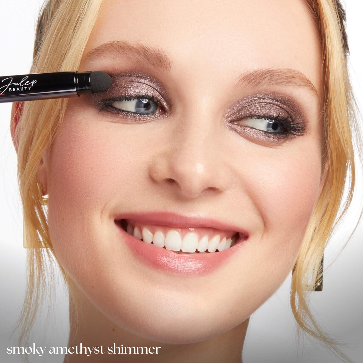Julep Eyeshadow 101 Smoky Amethyst Shimmer Stick applied on eyelid