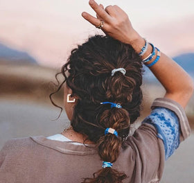 K'lani hair tie bracelet being used to secure a ponytail
