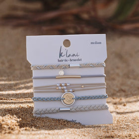 K'lani hair tie bracelet packaging on a table
