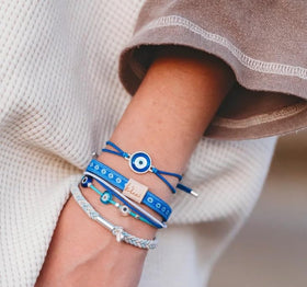 K'lani hair tie bracelet worn on a wrist, showcasing its dual function