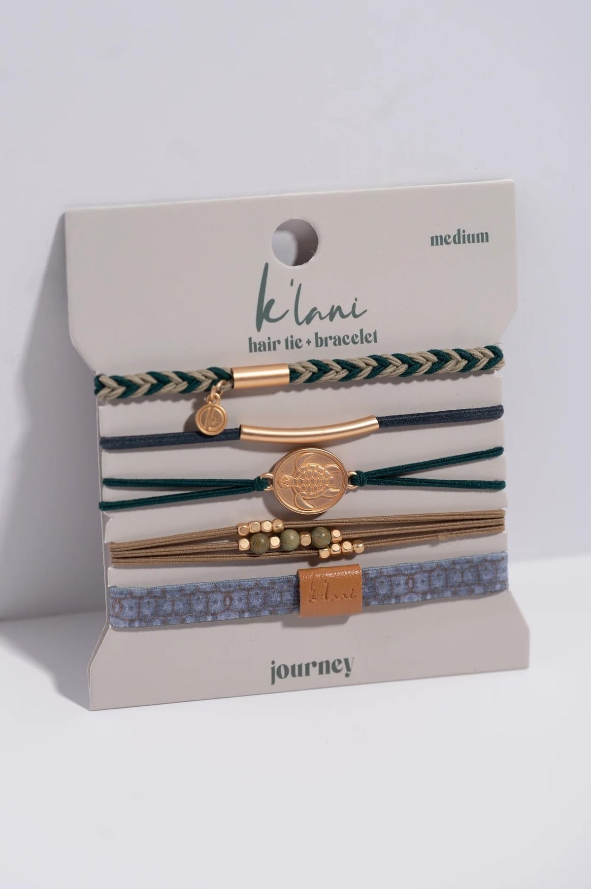 K'lani hair tie bracelet worn on wrist, styled with casual outfit