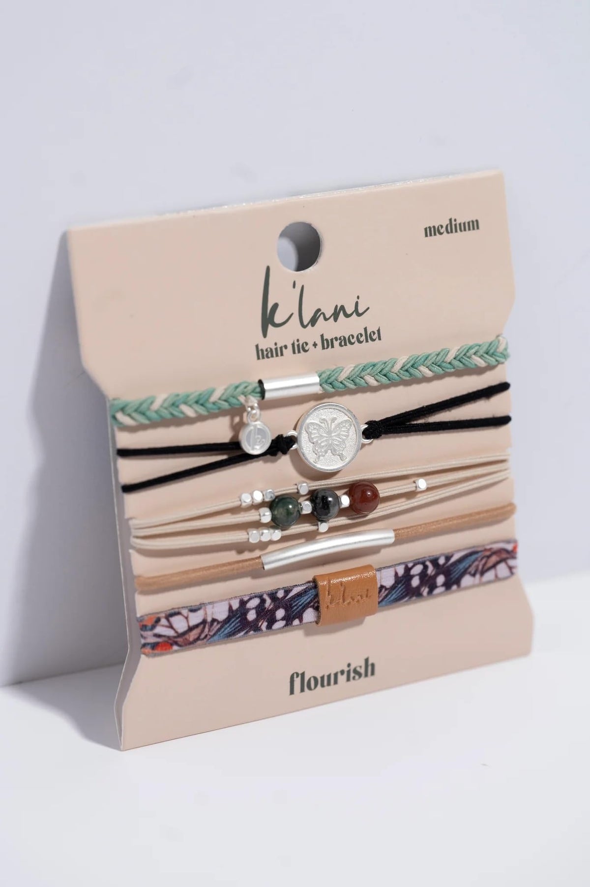 K'lani Hair Tie Bracelets stacked on a wrist in a boho style