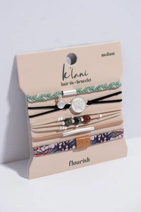 K'lani Hair Tie Bracelets stacked on a wrist in a boho style
