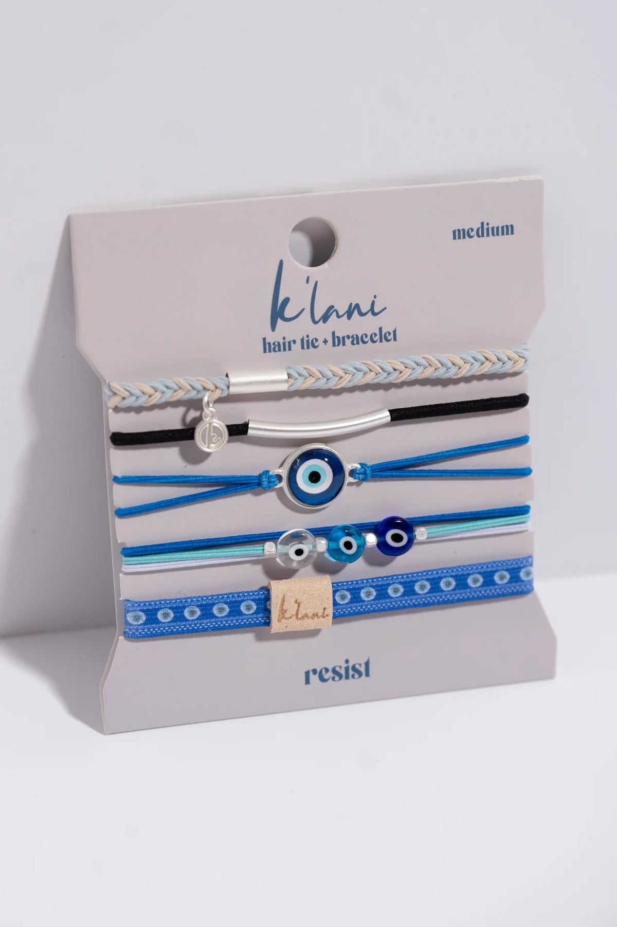 K'lani hair tie bracelets stacked together in a stylish arrangement