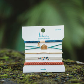 K'lani Imagine Hair Tie Bracelets packaging on a wooden surface