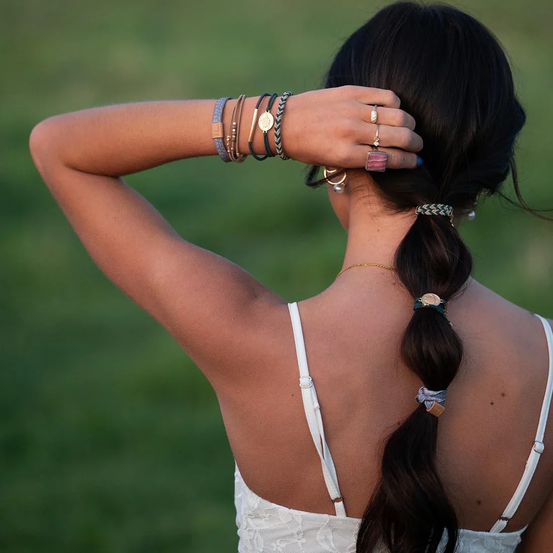 K'lani Journey Hair Tie Bracelets displayed in a decorative setting