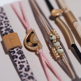 K'lani Wild Hair Tie Bracelet worn on wrist with casual outfit