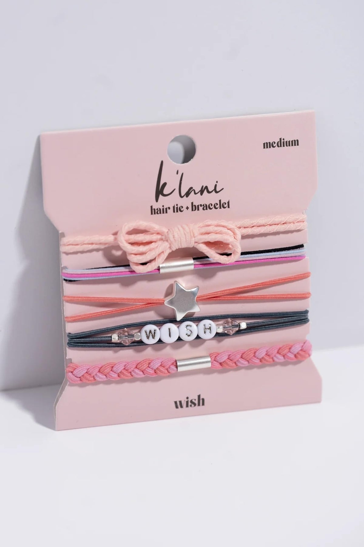K'lani Wish Hair Tie Bracelet worn as a stylish accessory on wrist