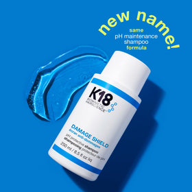 K18 Damage Shield Color Safe Shampoo in a lifestyle setting on a bathroom shelf