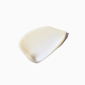 KÉRASTASE Densifique Conditioner in bathroom setting