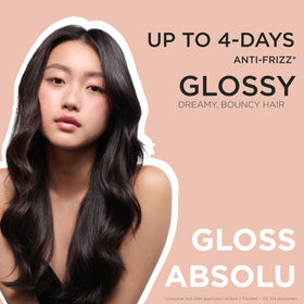 KÉRASTASE Gloss Absolu Conditioner being rinsed out