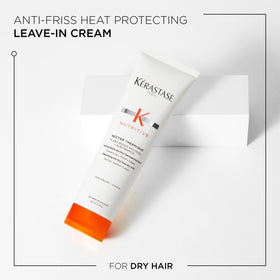 KÉRASTASE Nectar Thermique Cream in hand