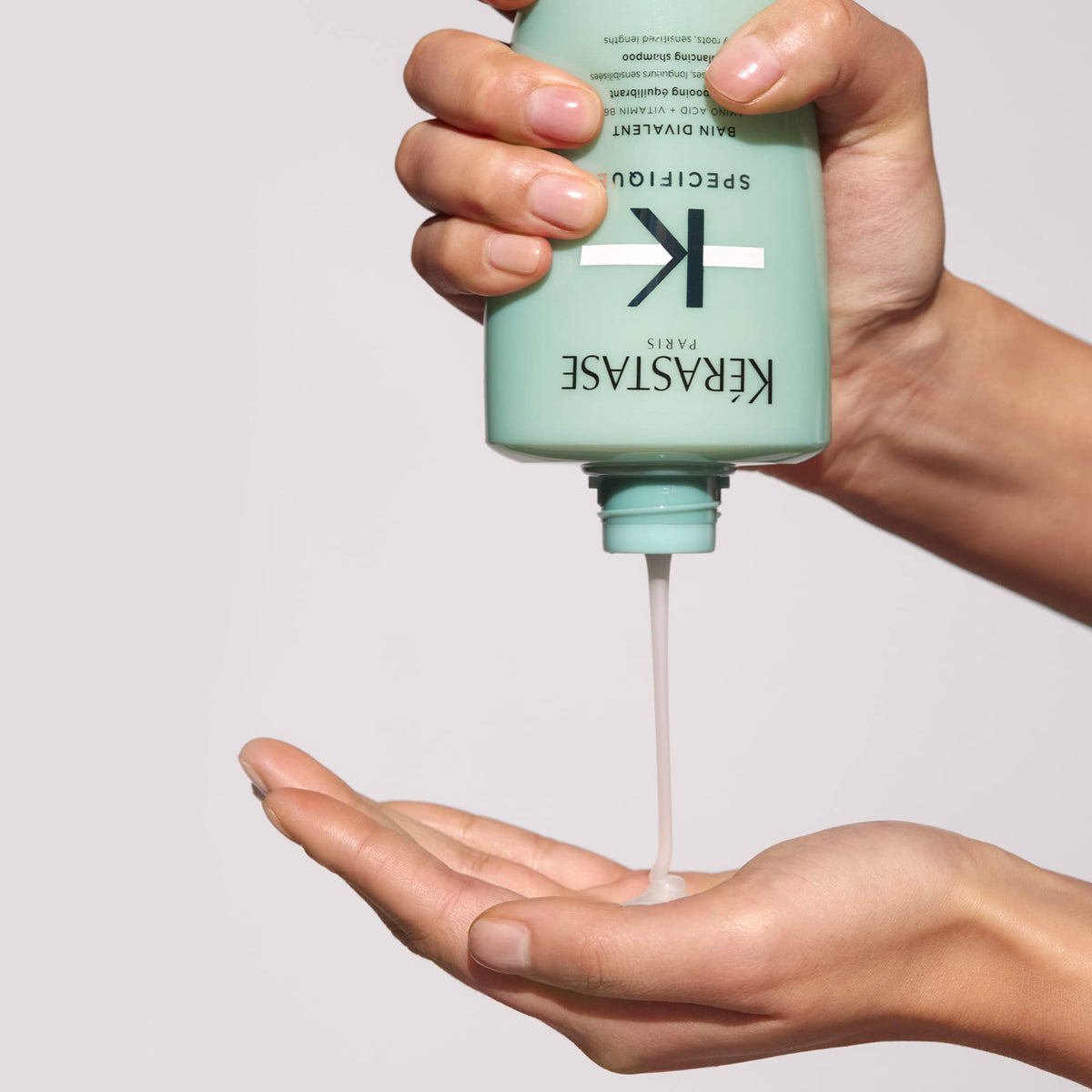 KÉRASTASE Specifique Balancing Shampoo on a vanity