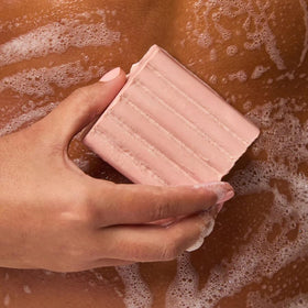 Kitsch Cleansing Tart Cherry Body Wash Bar Soap in hand