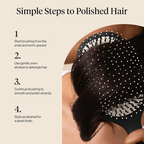 Kitsch Smooth & Polish Hair Brush in hand demonstrating use
