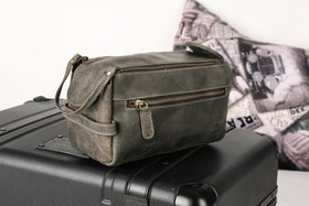KomalC Toiletry Bag in a travel setting