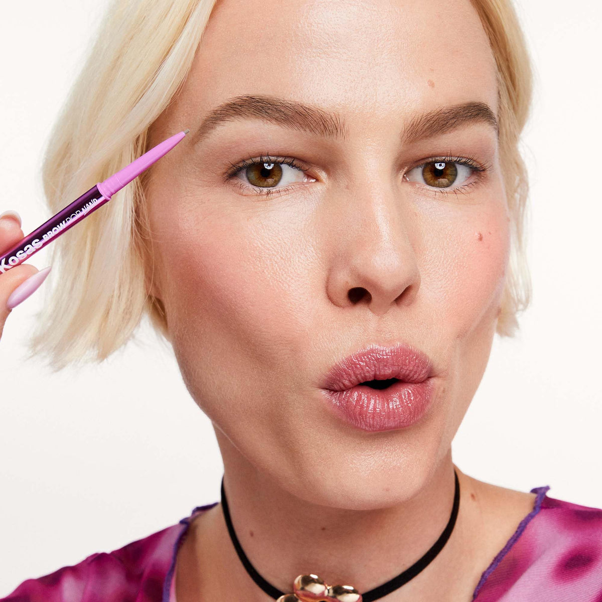 Kosas Brow Pop Nano Ultra-Fine Eyebrow Pencil Taupe applied on brows