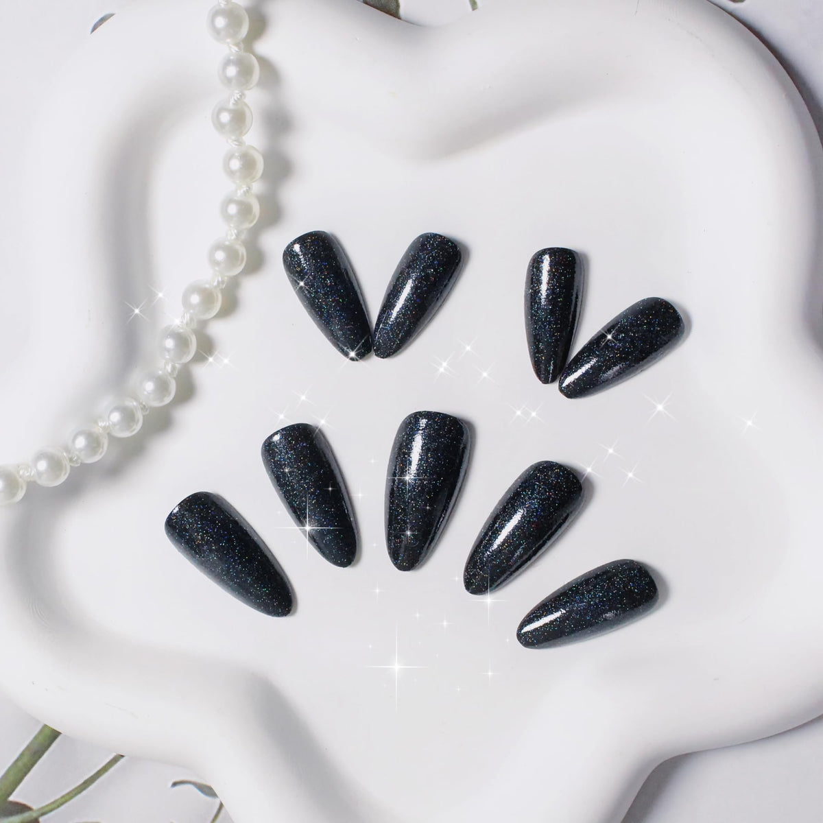 KQueenest Black Glitter Press on Nails applied on fingers