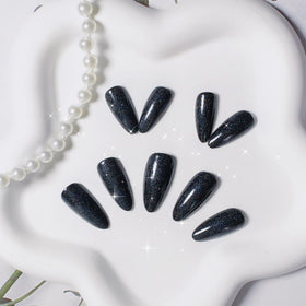 KQueenest Black Glitter Press on Nails applied on fingers