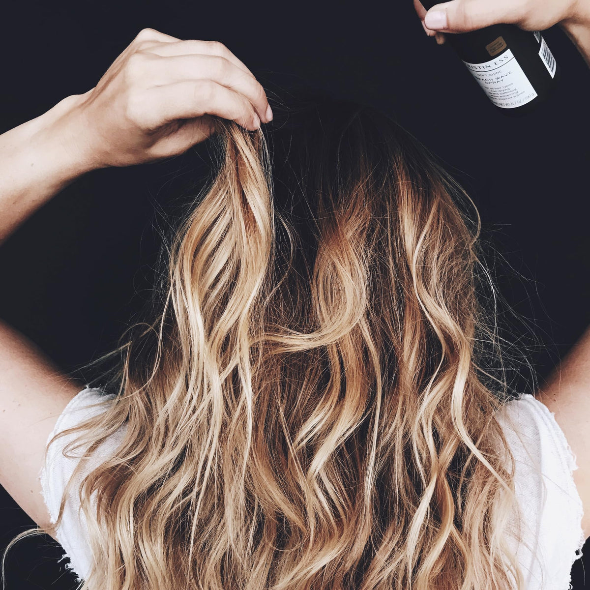 Kristin Ess Beach Wave Hair Spray 6.7 oz on vanity