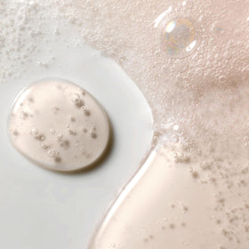 Kristin Ess shampoo lathering in hand