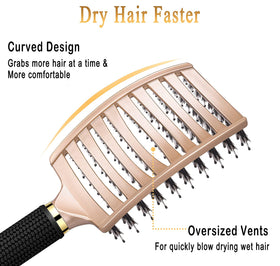 KTKUDY Detangling Brush being held in a hand for scale