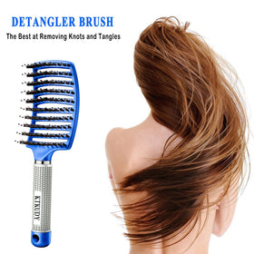 KTKUDY Detangling Brush in hand demonstrating non-slip grip